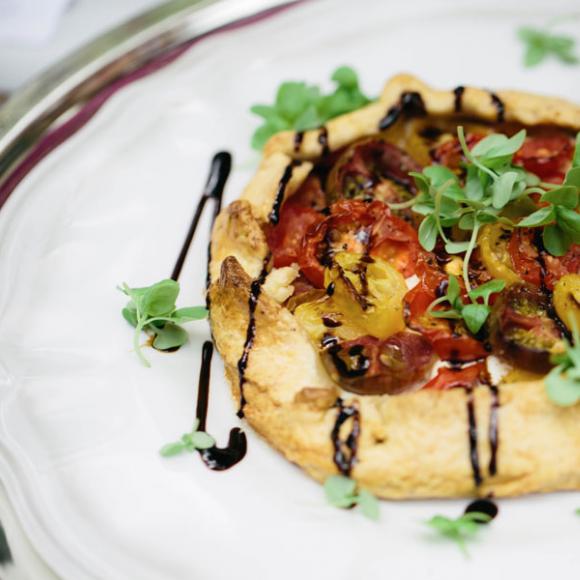  / Goats' cheese and heirloom tomato tart with balsamic glaze and baby basil